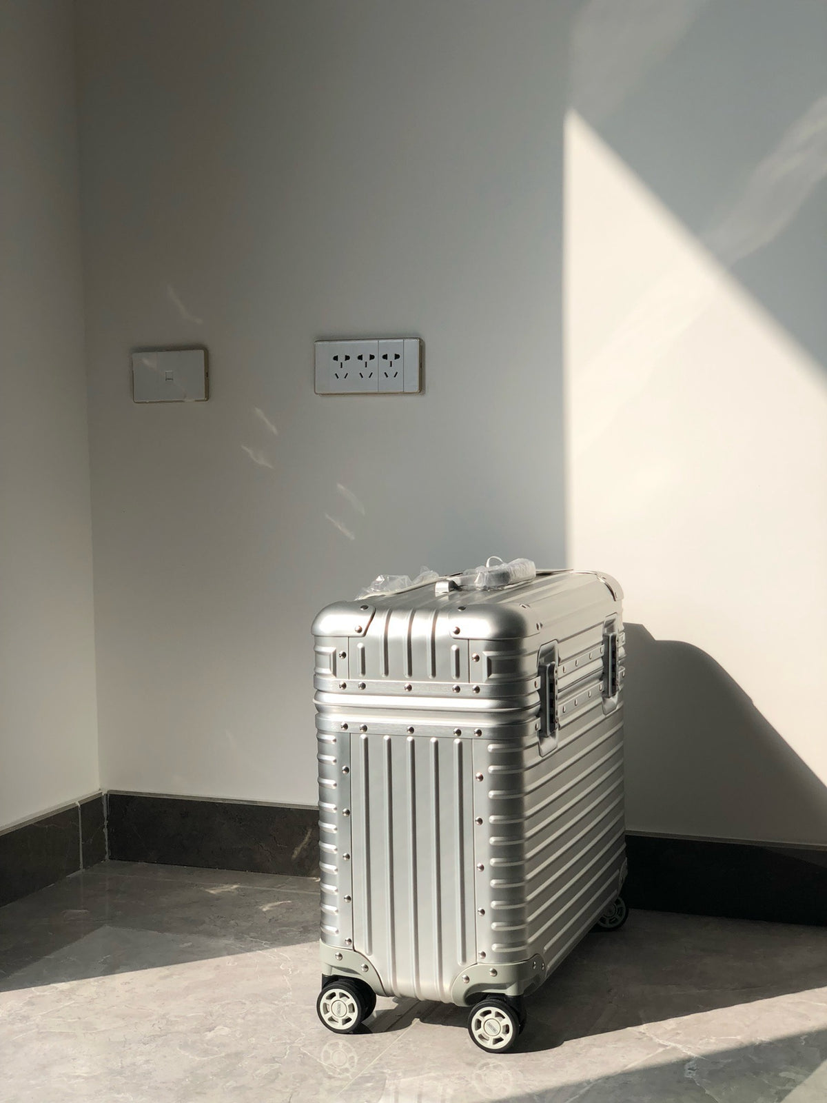 Silver and Black Suitcase