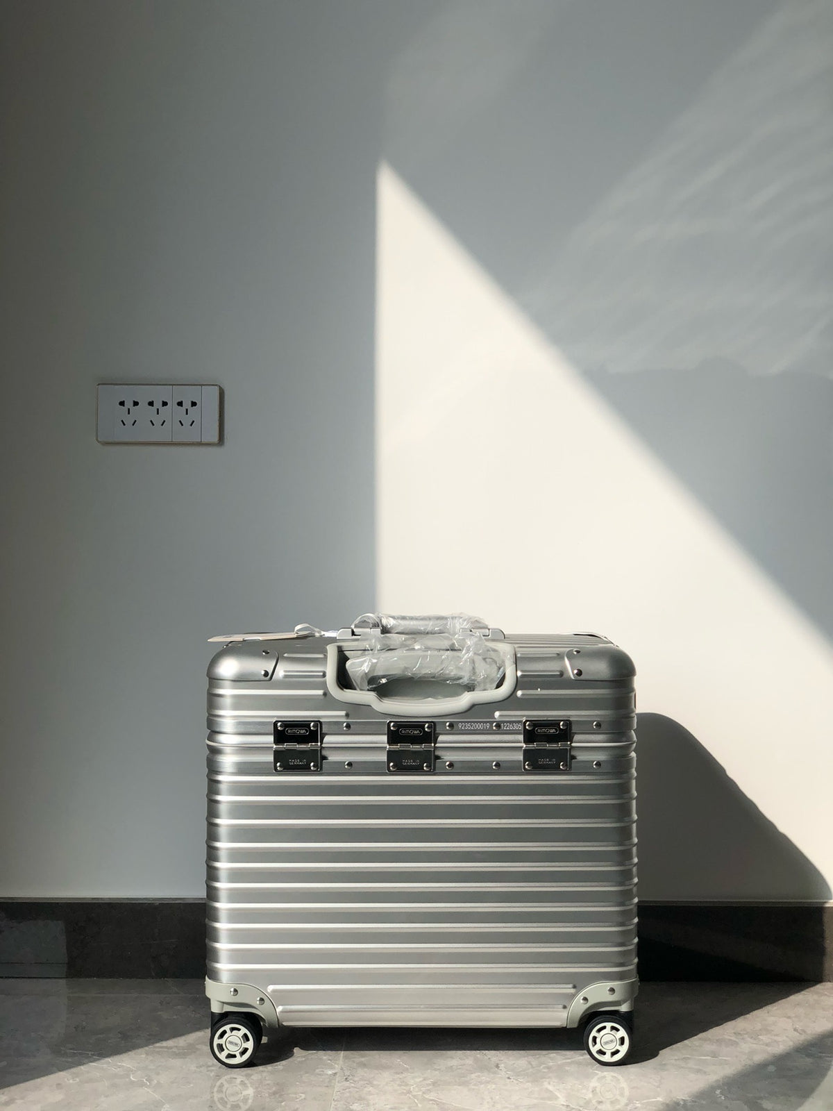Silver and Black Suitcase