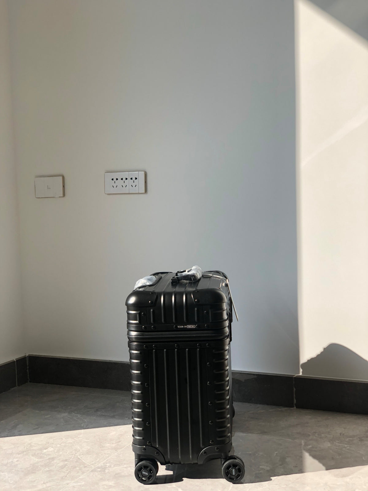 Silver and Black Suitcase